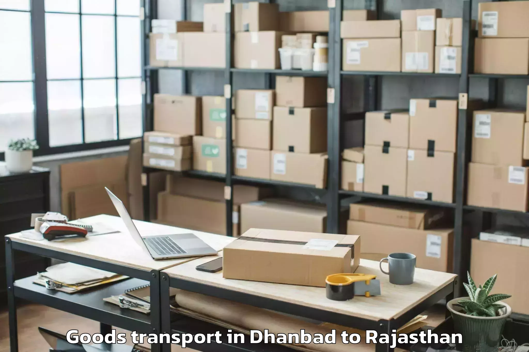 Top Dhanbad to Jk Lakshmipat University Jaipu Goods Transport Available